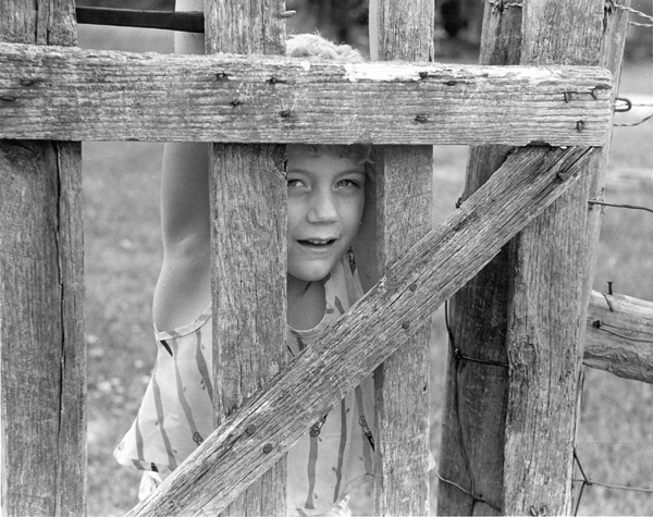 Girl at a gate, Burnside, Ky., on my first visit there in 1986. Photo by Pat Arnow