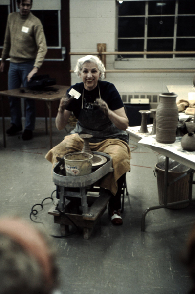 Edna Arnow demonstrating pottery making. Mike Banner is in the background. 