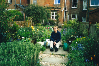 Marcella in the garden behind her house in Winchester, 1999. Everything seemed to be blooming. (Pat Arnow's photo)