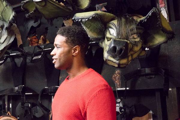 L. Steven Taylor, who plays the Lion King Mufasa on Broadway, backstage after the show, being eyed by a hyena.