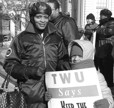 A FAMILY MATTER: Subway Station Agent Gale Broughton and her daughter, Sezlyn Petersen, were among those who came to City Hall March 3 to rally opposition to the closing of token booths. (03.11.05)
