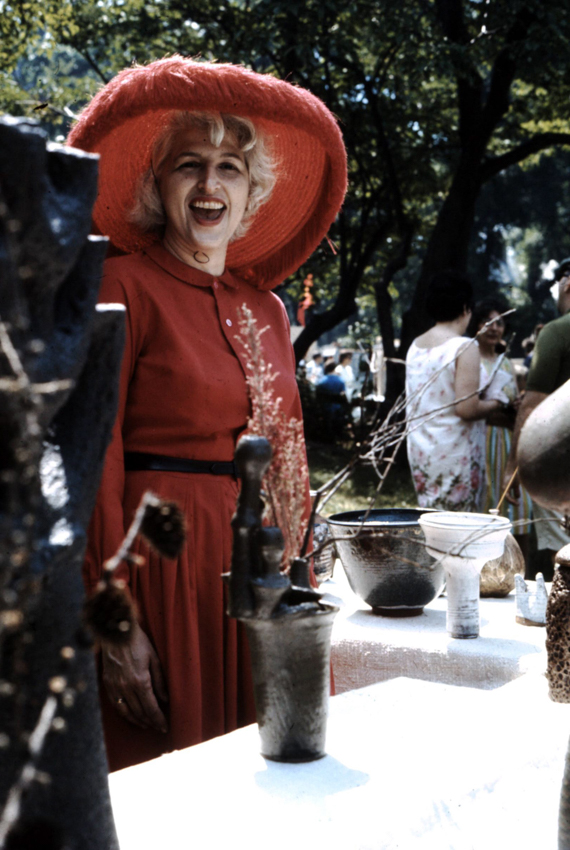 Edna dressed in red at an art fair, in the 1950s. 