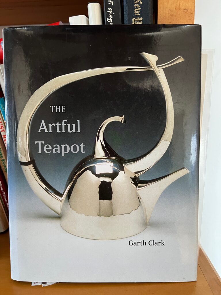 Banner silver teapot on cover of boo about teapots.