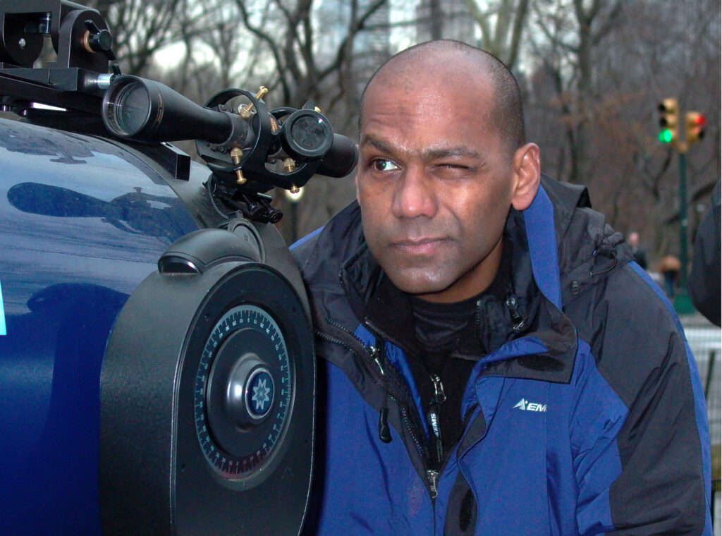 Lincoln Karin with his telescope spotting the boreal owl in Central Park. He's the author of palemale.com, a website devoted to the red-tailed hawks who reside on 5th Ave.