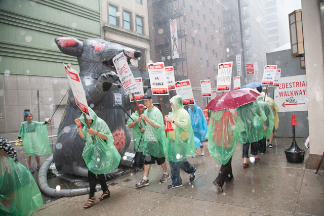 Research Foundation workers and supporters on the picket line during a rainstorm, with PSC, union for City University of New York. 2013.