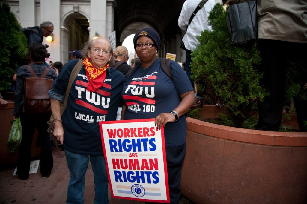 TWU (Transit Workers Union) members with a Workers Rights are Human Rights sign at a Occupy Wall Street protest