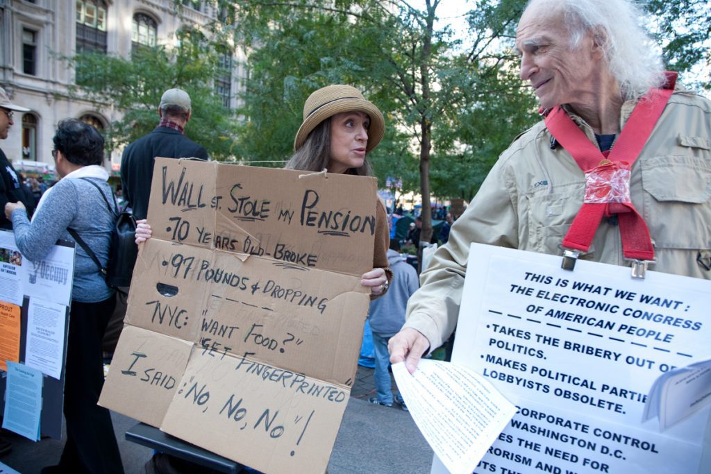 "Wall Street Stole My Pension" sign held by Miriam Cantor, a victim of Bernie Madoff's massive fraud.