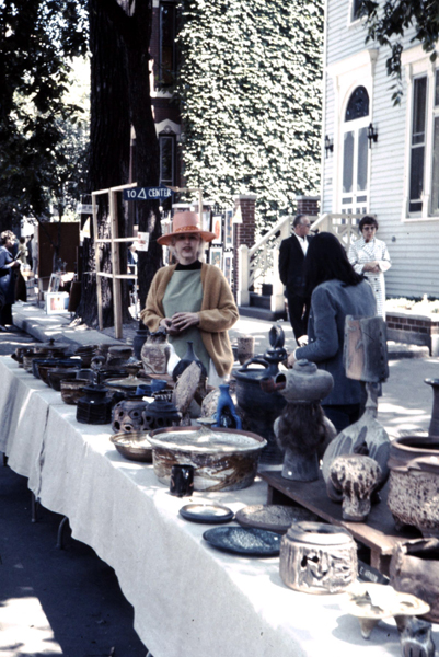 Edna and her pottery at the Old Town Art Fair in 1969. The pottery at right is covered in her characteristic "crud" glaze that she developed.
