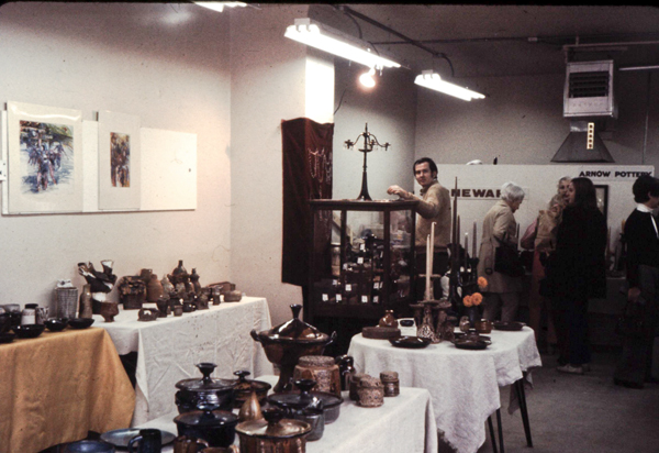 For a couple of years in the late 1960s and early 1970s, the Arnows rented a storefront from the CTA under the "el" tracks on Lunt Avenue on the far north side (Morris Avenue stop). Here is Edna's pottery on display for an open house. Michael Banner is standing by his jewelry case.